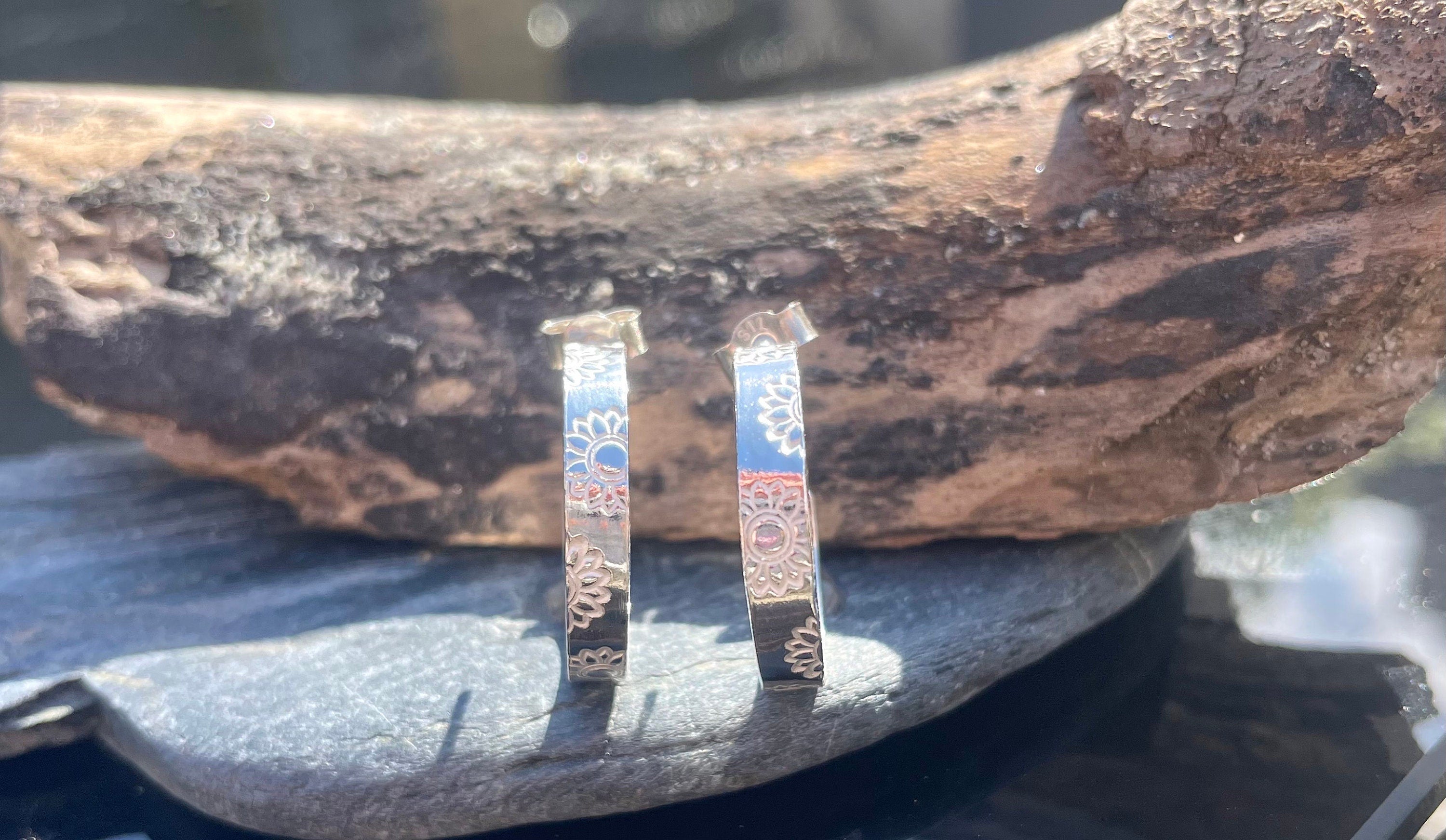 Silver sunflower hoop earrings